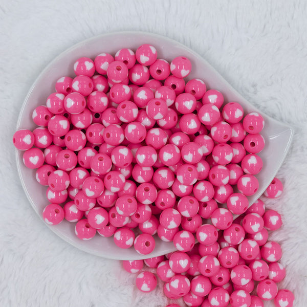 Top view of a pile of 12mm Pink with White Heart Chunky Acrylic Bubblegum Beads [20 Count]