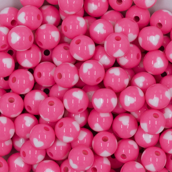 Close up view of a pile of 12mm Pink with White Heart Chunky Acrylic Bubblegum Beads [20 Count]