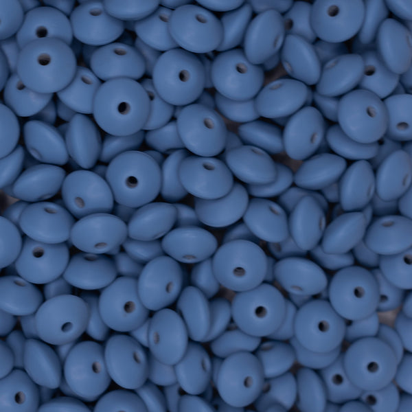 top view of a pile of 12mm Powder Blue Lentil Silicone Bead