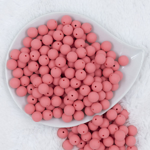 Top view of a pile of 12mm Punch Pink Matte Acrylic Bubblegum Beads