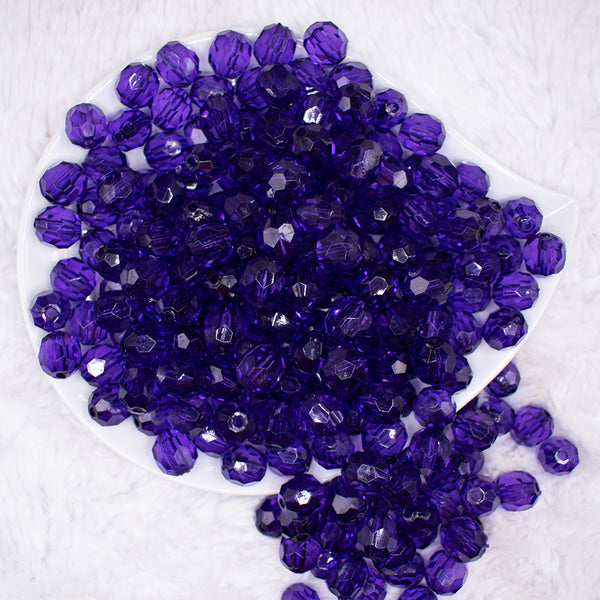top view of a pile of 12mm Dark Purple Transparent Faceted Shaped Bubblegum Beads
