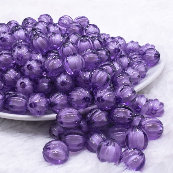 front view of a pile of 12mm Purple Transparent Pumpkin Shaped Bubblegum Beads