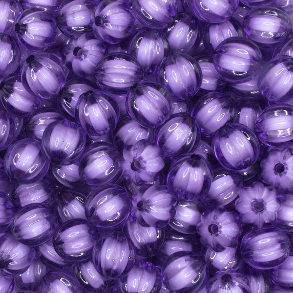 close up view of a pile of 12mm Purple Transparent Pumpkin Shaped Bubblegum Beads