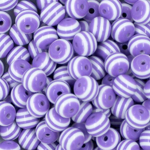Close up view of a pile of 12mm Iris Purple with White Stripes Resin Chunky Bubblegum Beads
