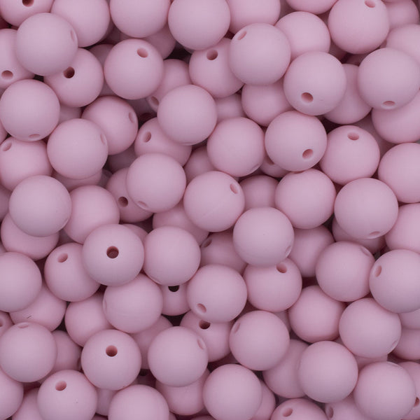 Top view of a pile of 12mm Quartz Pink Round Silicone Bead