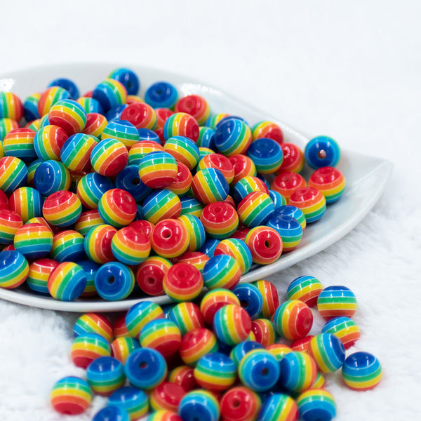Front view of a pile of 12mm Thick Rainbow Stripes Resin Chunky Bubblegum Beads