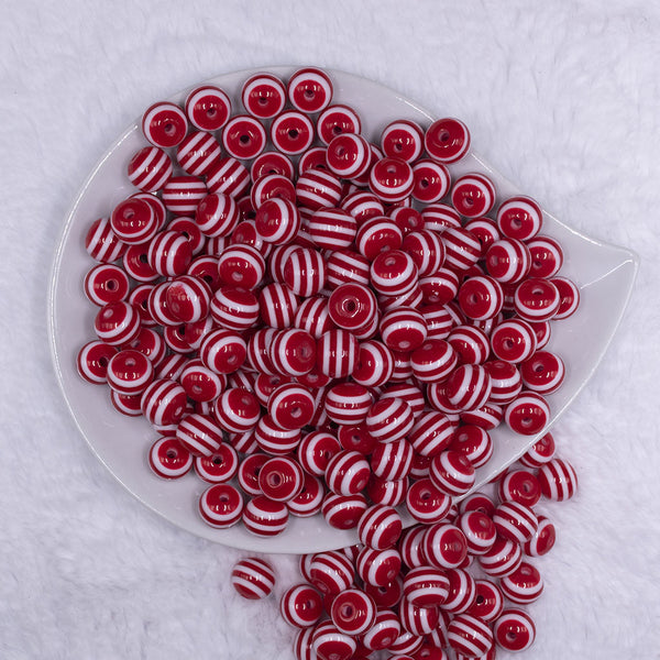 Top view of a pile of 12mm Red with White Stripes Resin Chunky Bubblegum Beads
