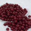 Front view of a pile of 12mm Red Glitter Sparkle Chunky Acrylic Bubblegum Beads - 20 Count