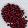 Top view of a pile of 12mm Red Glitter Sparkle Chunky Acrylic Bubblegum Beads - 20 Count