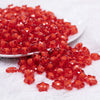 front view of a pile of 12 Red Transparent Star Shaped Bubblegum Beads - 20 Count