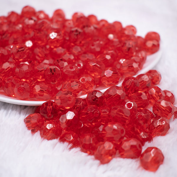 front view of a pile of 12mm Red Transparent Faceted Shaped Bubblegum Beads