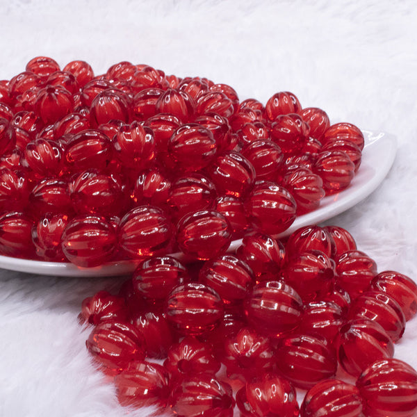 front view of a pile of 12mm Red Transparent Pumpkin Shaped Bubblegum Beads
