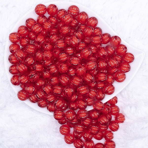 top view of a pile of 12mm Red Transparent Pumpkin Shaped Bubblegum Beads
