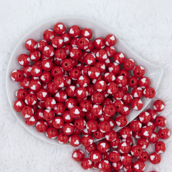 Top view of a pile of 12mm Red with White Heart Chunky Acrylic Bubblegum Beads [20 Count]