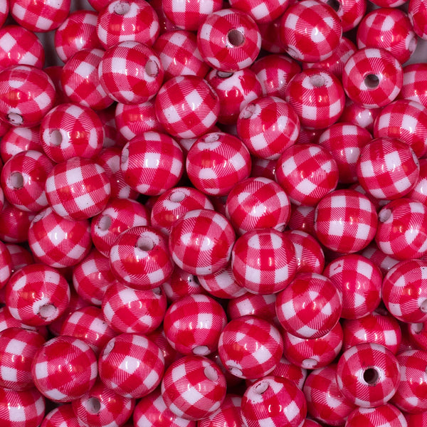 Close up view of a pile of 12mm Red & White Picnic Plaid Print Chunky Acrylic Bubblegum Beads - 20 Count