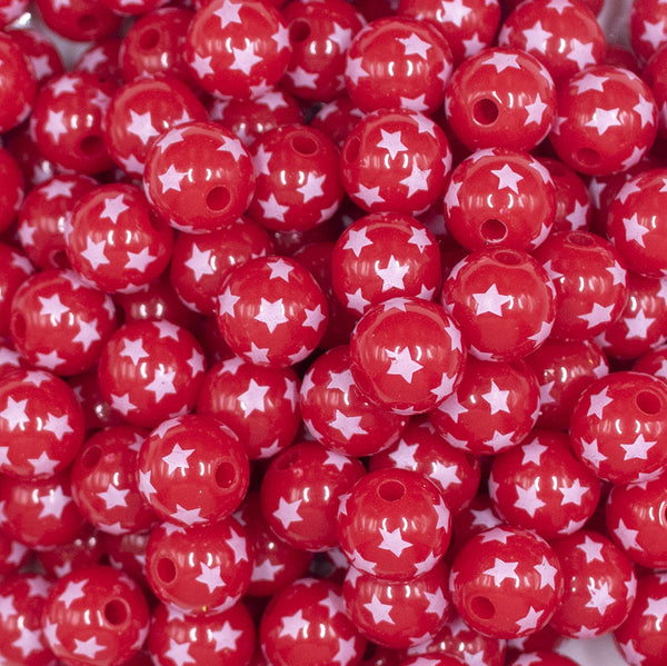 Close up view of a pile of 12mm Red with White Stars Acrylic Bubblegum Beads