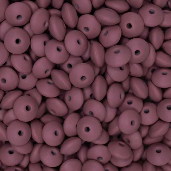 top view of a pile of 12mm Rose Pink Lentil Silicone Bead