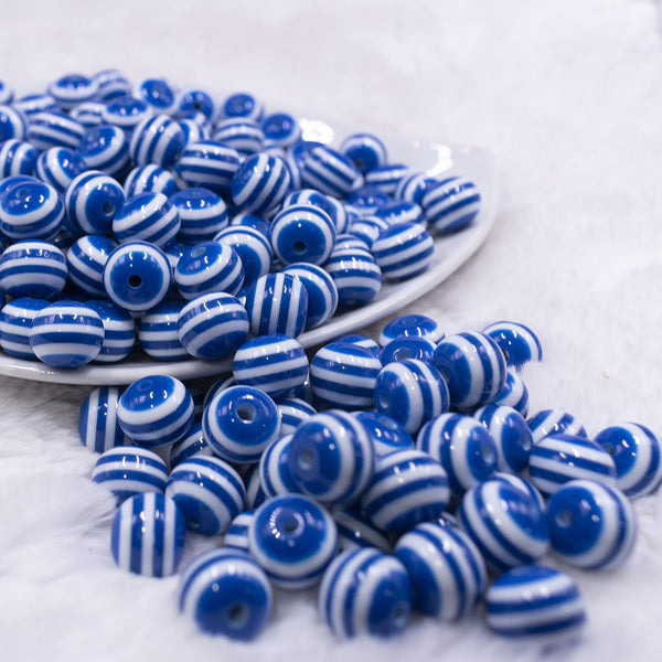 Front view of a pile of 12mm Royal Blue with White Stripes Resin Chunky Bubblegum Beads