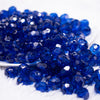 front view of a pile of 12mm Royal Blue Transparent Faceted Shaped Bubblegum Beads