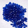 top view of a pile of 12mm Royal Blue Transparent Faceted Shaped Bubblegum Beads