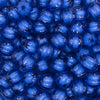 Close up view of a pile of 12mm Royal Blue Transparent Pumpkin Shaped Bubblegum Beads