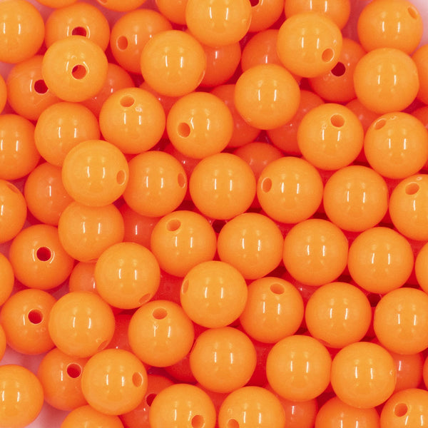 Close up view of a pile of 12mm Safety Orange Acrylic Bubblegum Beads [20 & 50 Count]