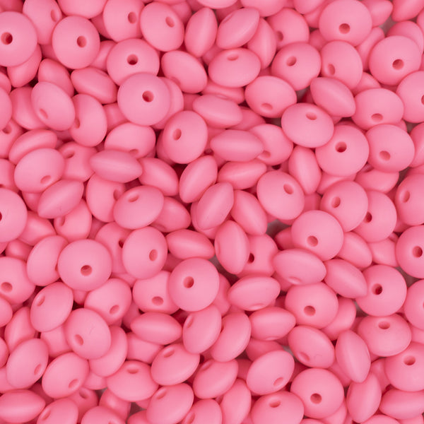 front view of a pile of 12mm Sakura Pink Lentil Silicone Bead