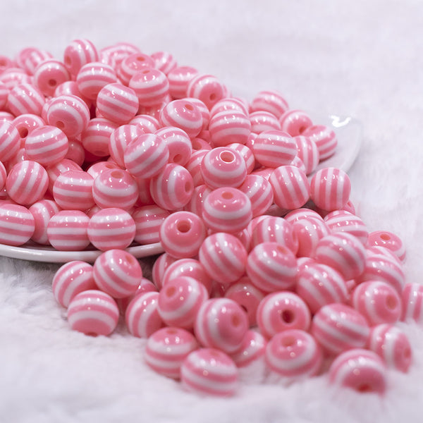Front view of a pile of 12mm Salmon Pink with White Stripes Resin Chunky Bubblegum Beads