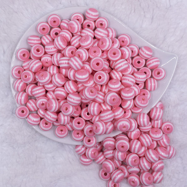 Top view of a pile of 12mm Salmon Pink with White Stripes Resin Chunky Bubblegum Beads