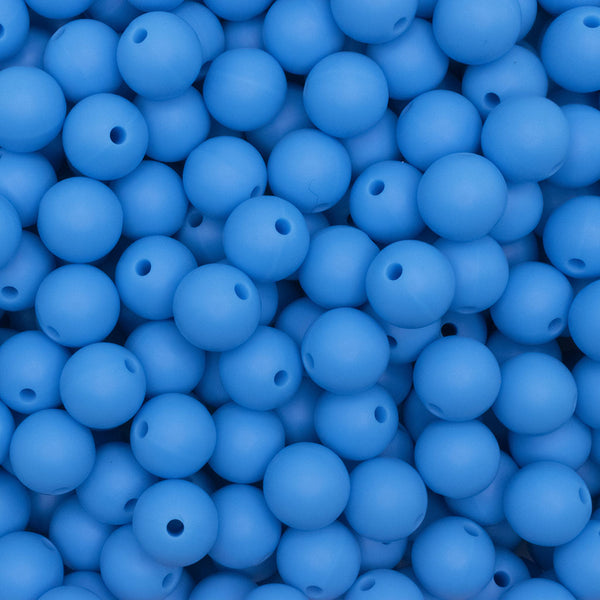 close up view of a pile of 12mm Sky Blue Round Silicone Bead