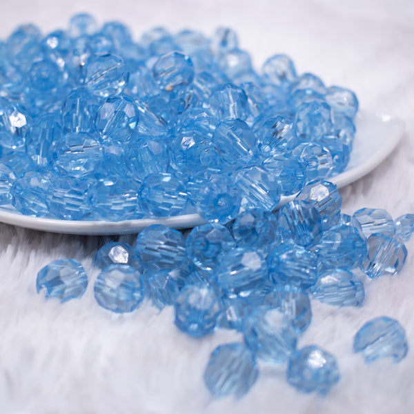 front  view of a pile of 12mm Sky Blue Transparent Faceted Shaped Bubblegum Beads
