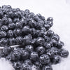 front view of a pile of 12mm Black & White Snake Print Acrylic Bubblegum Beads - 20 Count