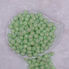 Top view of a pile of 12mm Spearmint Green Rhinestone Bubblegum Beads [10 & 20 Count]