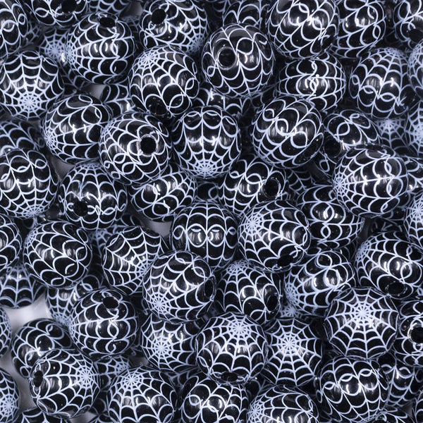 close up view of a pile of 12mm Black & White Spider Web Print Bubblegum Beads