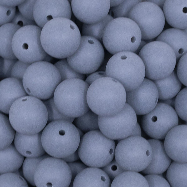 Close up view of a pile of 12mm Steel Blue Matte Acrylic Bubblegum Beads