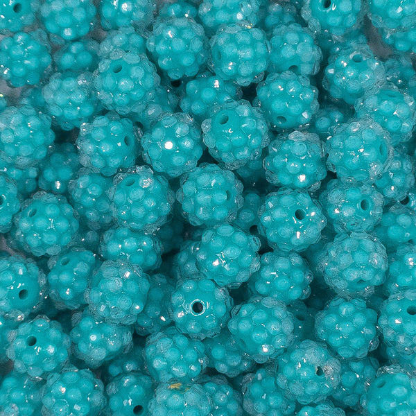 Close up view of a pile of 12mm Teal with Clear Rhinestone Bubblegum Beads - Choose Count