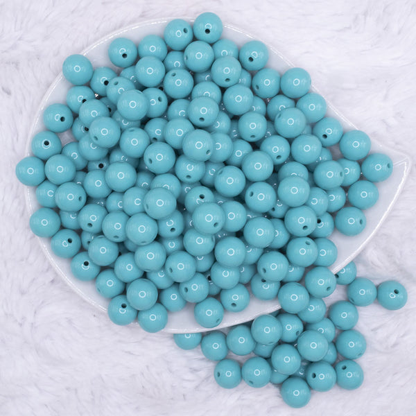 top view of a pile of 12mm Turquoise Blue Solid Acrylic Bubblegum Beads