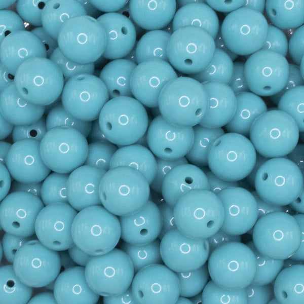 close up view of a pile of 12mm Turquoise Blue Solid Acrylic Bubblegum Beads