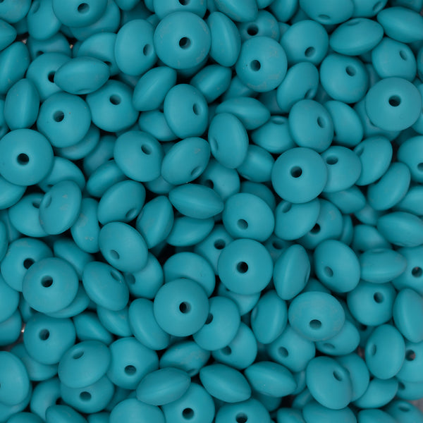 top view of a pile of 12mm Turquoise Blue Lentil Silicone Bead