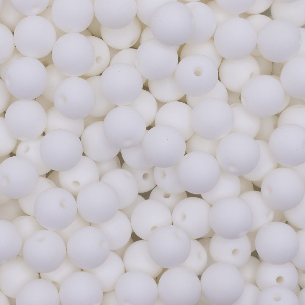 Various sizes of industrial-grade silicone beads on white background Various sizes of industrial-grade silicone beads on white background