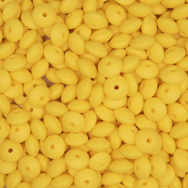top view of a pile of 12mm Yellow Lentil Silicone Bead