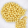 top view of a pile of 12mm Yellow Pearl Acrylic Bubblegum Beads [20 Count]