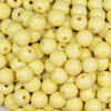 Close up view of a pile of 12mm Pastel Yellow Plaid Print Chunky Acrylic Bubblegum Beads - 20 Count