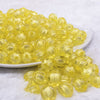 front view of a pile of 12mm Yellow Transparent Pumpkin Shaped Bubblegum Beads