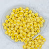 Top view of a pile of 12mm Yellow with White Stripes Resin Chunky Bubblegum Beads