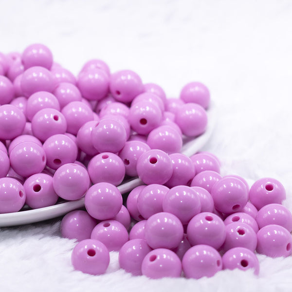 Front view of a pile of 12mm Taffy Pink Solid Acrylic Bubblegum Beads