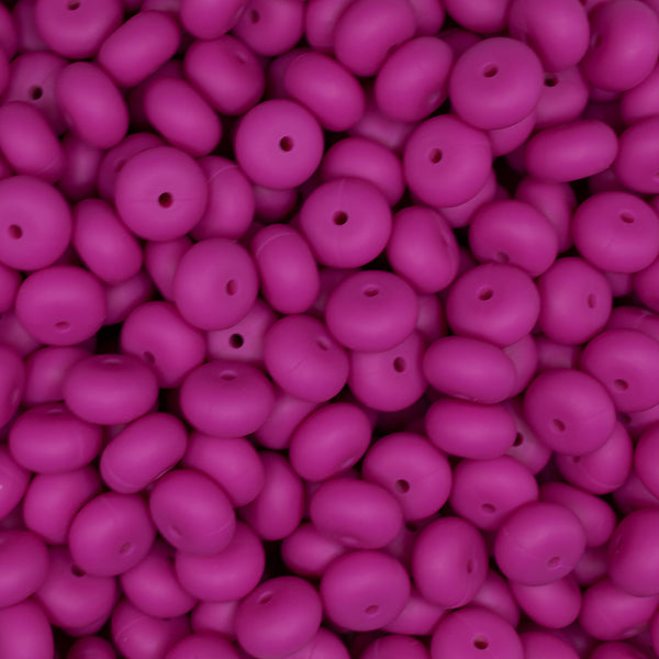 top view of a pile of 14mm Hot Pink Abacus Silicone Bead