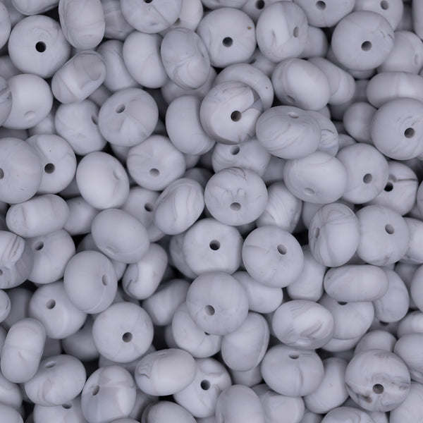 top view of a pile of 14mm Marble White Abacus Silicone Bead