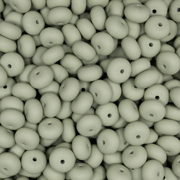 top view of a pile of 14mm Matcha Green Abacus Silicone Beads