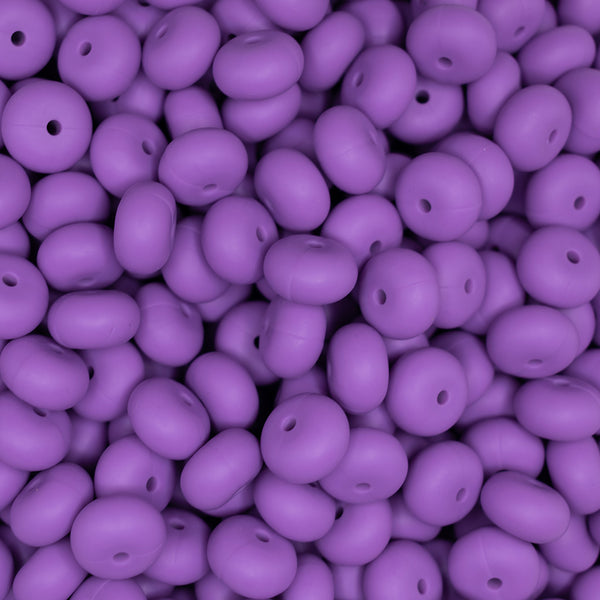 top view of a pile of 14mm Purple Abacus Silicone Beads